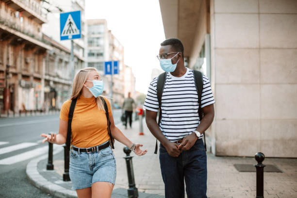 istock An interracial group of students traveling with protective face masks 1270217086