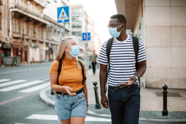 istock An interracial group of students traveling with protective face masks 1270217232