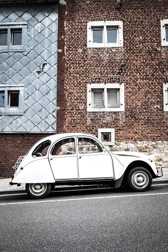 Classic French Citroën 2CV car parked on the side of the street. The deux chevaux front-wheel-drive economy car was introduced in 1948 and was produced until 1990!
