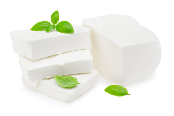 istock Slices feta cheese with basil isolated on white background. Clipping path and full depth of field 1270217524