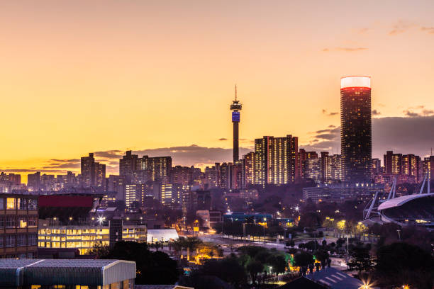 Johannesburg cityscape with the communication tower Johannesburg inner cityscape with the communication tower and ponte flats, at sunset dusk, Johannesburg is also known as Jozi, Jo'burg or eGoli, is the largest city in South Africa. johannesburg stock pictures, royalty-free photos & images