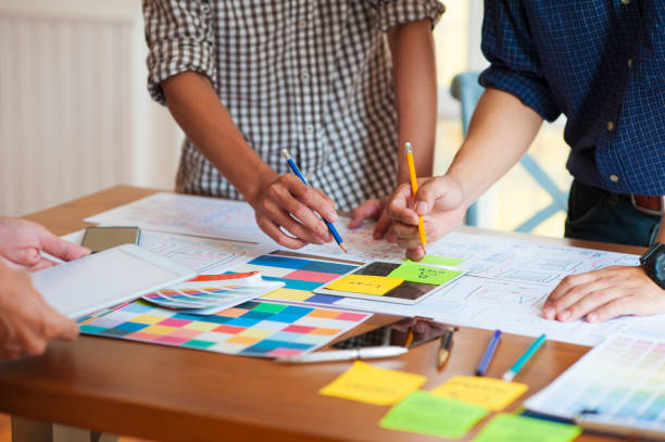 istock Designers are discussing creative ideas about designing web sites and mobile applications. 1270220332
