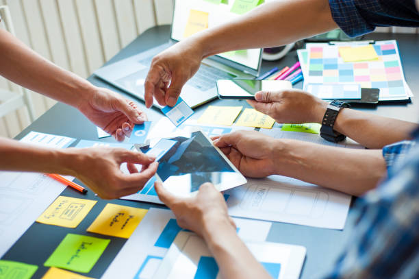 istock Designers brainstorm ideas to design mobile applications. 1270220412
