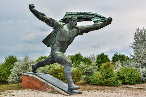 Budapest, Hungary - June 6, 2017. Republic of Councils Monument at Memento Park in Budapest. Bronze monument by Istvan Kiss dates from 1969 and was originally located at Dozsa Gyorgy street (Felvonulasi ter).