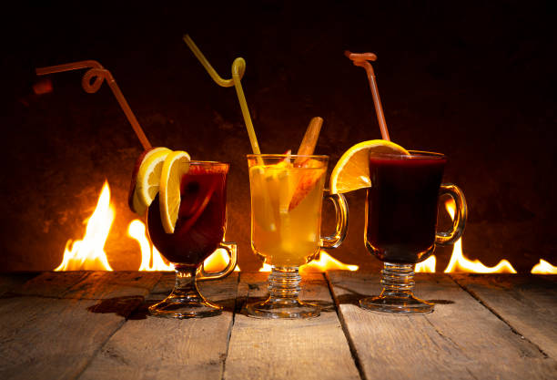 istock Three mulled wine glasses against the fire. Christmas mood background. 1270222108