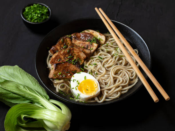 istock Ramen Noodle and Chicken Soup on the yellow background. 1270224673
