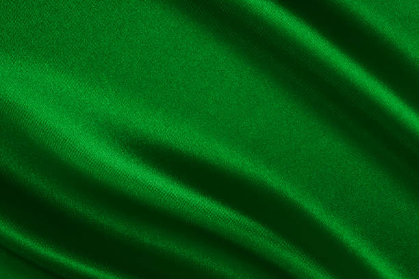 green satin background - green silk textile shiny imagens e fotografias de stock