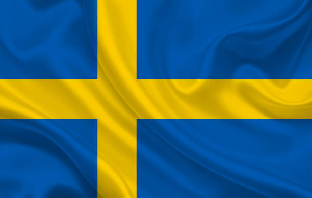 istock Sweden country flag on wavy silk fabric background panorama 1270227326