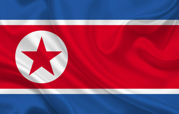 istock DPRK country flag on wavy silk fabric background panorama 1270228181