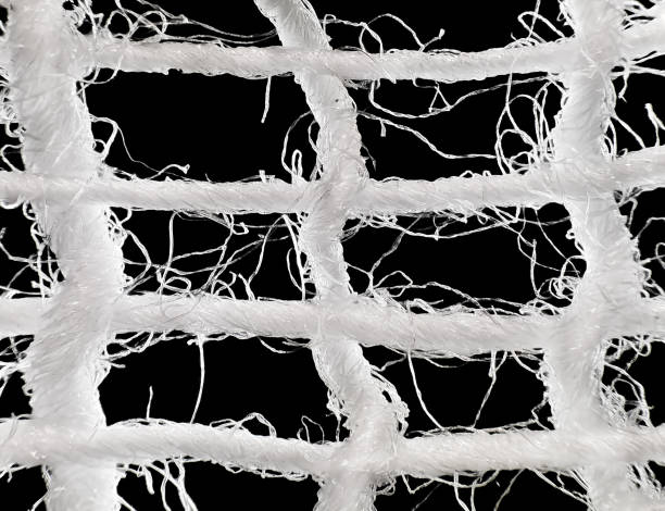 White gauze fabric under the microscope close-up, isolated on black background