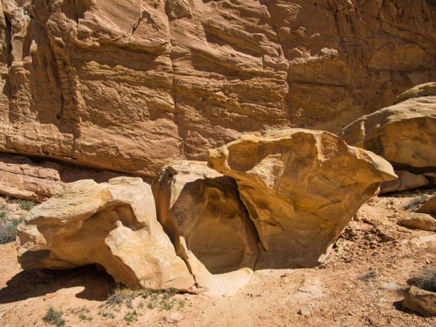 istock Colored boulders in front of a brown rock face 1270242487