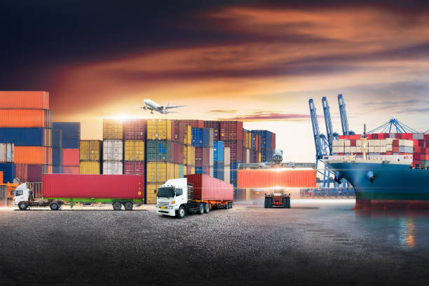 istock Business logistics and transportation concept of containers cargo freight ship and cargo plane with working crane in shipyard at sunset sky, logistic import export and transport industry background 1270242786
