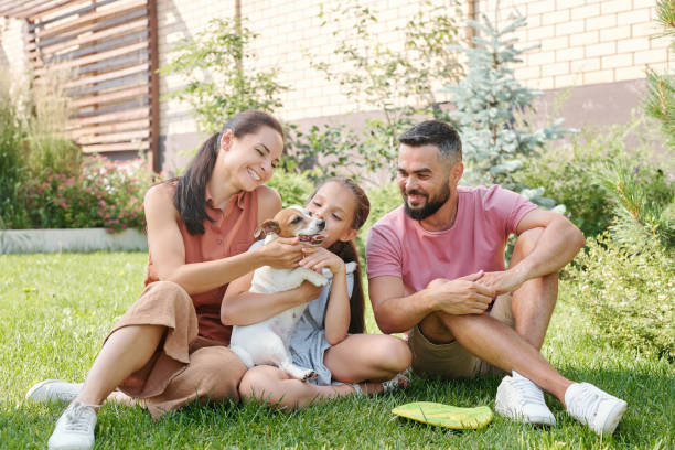 istock Happy Family With Dog 1270243013