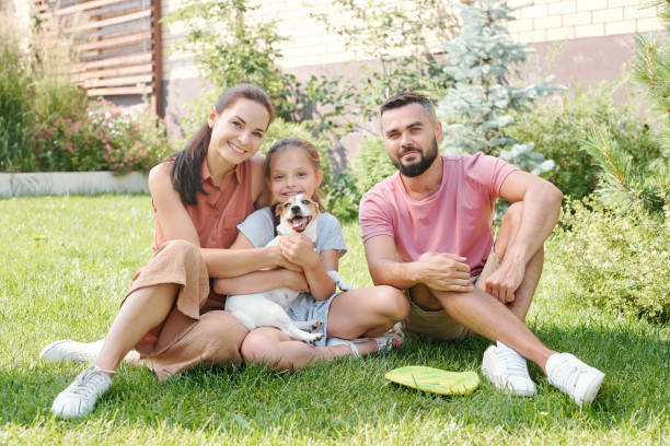 istock Family Of Three With Dog 1270243024