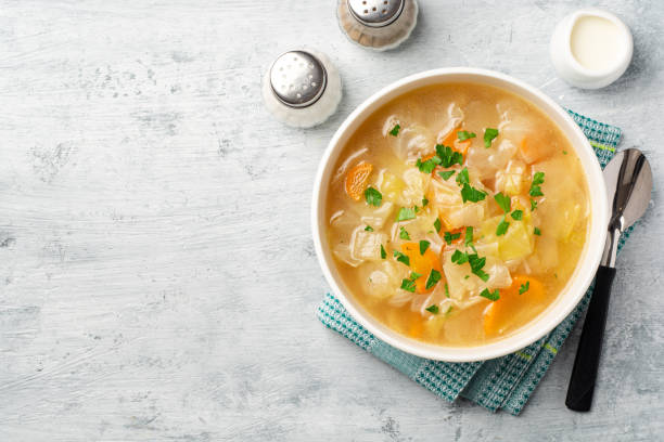 istock Homemade cabbage soup in bowl on concrete background 1270243109