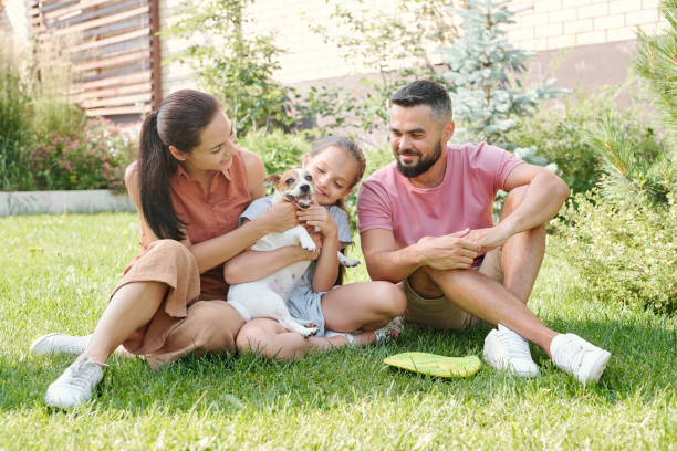 istock Family Petting Happy Dog 1270243164