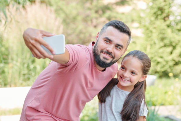 istock Father And Daughter Taking Selfie 1270244031