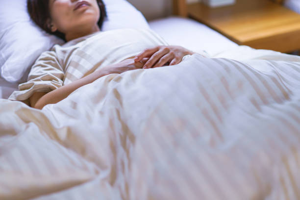 istock middle aged woman is sleeping on the bed 1270244136