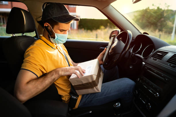 istock Courier making deliveries in his van 1270244950