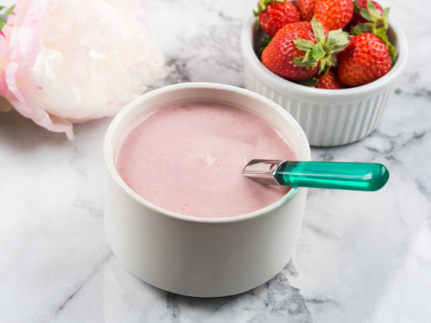 istock Strawberry yogurt in small ramekin on marble 1270245768