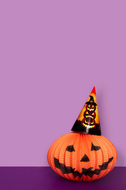 istock Halloween paper pumpkin in party hat. 1270248008