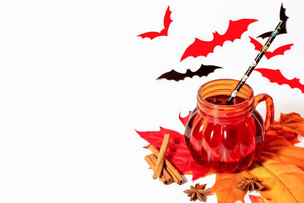 istock Halloween mulled wine in pumpkin shape mug with spices. 1270248150