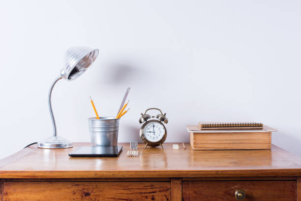 istock Accessories Alarm Clock Lamp Wooden Office Desk 1270249627