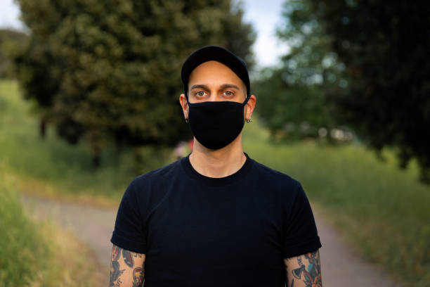 istock Young Men With Mask Outdoors 1270251426