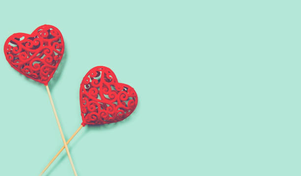 istock Abstract composition with decorative hearts on colorful background. Valentine day theme. 1270251736