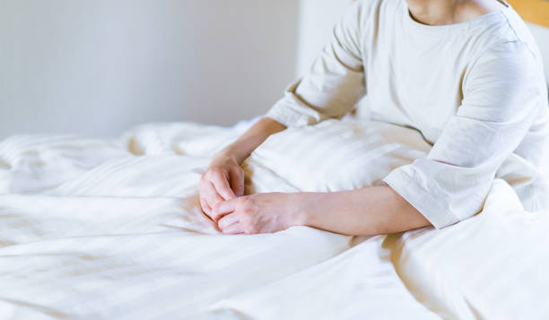 istock middle aged woman get up early on the bed 1270252024