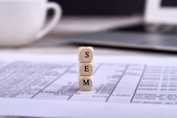 istock Three toy wood blocks with letters sem on a document. 1270255412