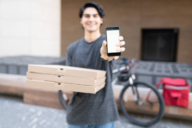 istock Young Food Delivery Man Delivering Pizza 1270256909