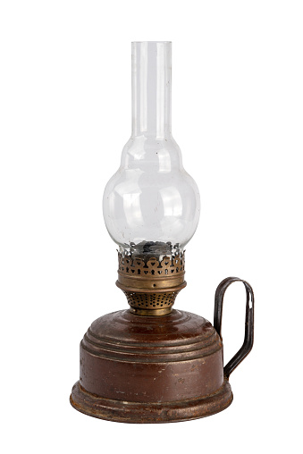 An old kerosene lamp. Historical household item. Original utensils. culture of Russia. Objects on a white isolated background.