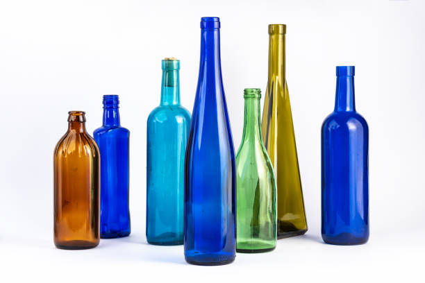 istock A row of empty glass wine bottles, different colors on a white background 1270260997