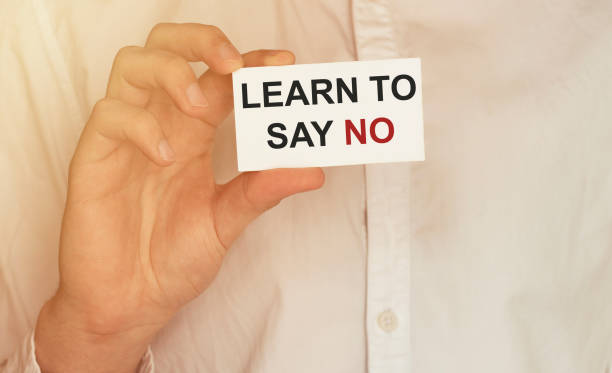 istock man take a paper with text Learn To Say No on the shirt 1270261559