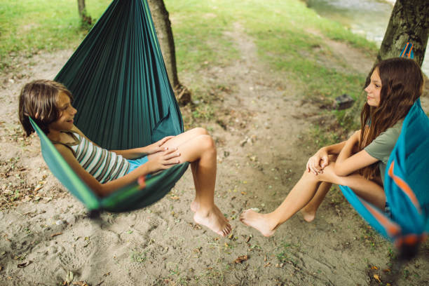 istock Children relaxing in hammock 1270261697