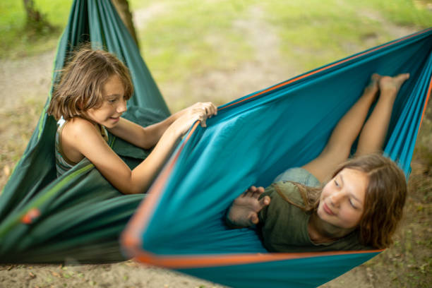 istock Children relaxing in hammock 1270261702