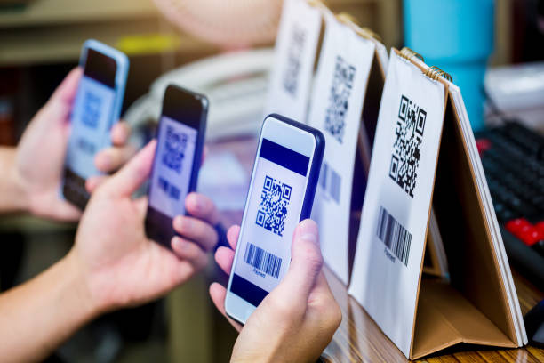 istock Many customer hands holding smart phone to scan Qr code payment and barcode. 1270261844