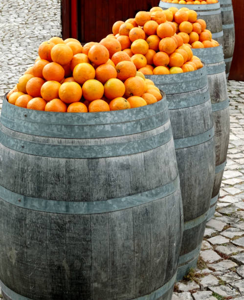 Oranges stored in oak barrels.
