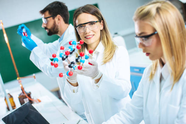 istock Young Scientists at the laboratory looking at dna 1270263161