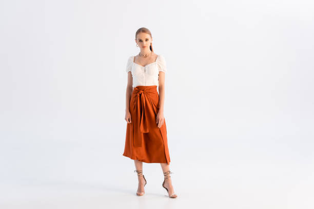 full length view of fashionable woman posing on white full length view of fashionable woman posing on white blouse photos stock pictures, royalty-free photos & images