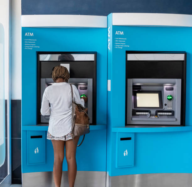 istock Young African woman with braids doing her banking 1270264553