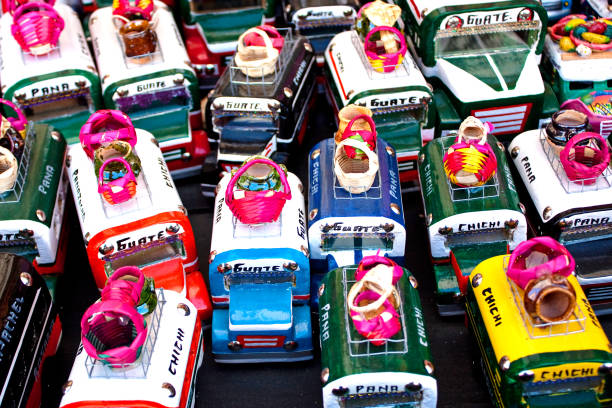 Small souvenir buses with load on a weekend market stall, Chichicastenango, Guatemala