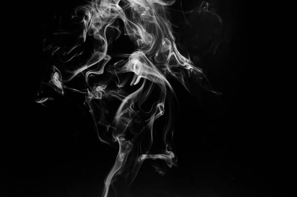 istock abstract fragment movement of white smoke on black background. 1270264635