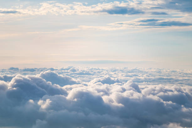 View at sunrise with puffy foggy. View at sunrise with puffy foggy. White puffy like cloud stretching to foggy horizon in the bright morning. overcast stock pictures, royalty-free photos & images