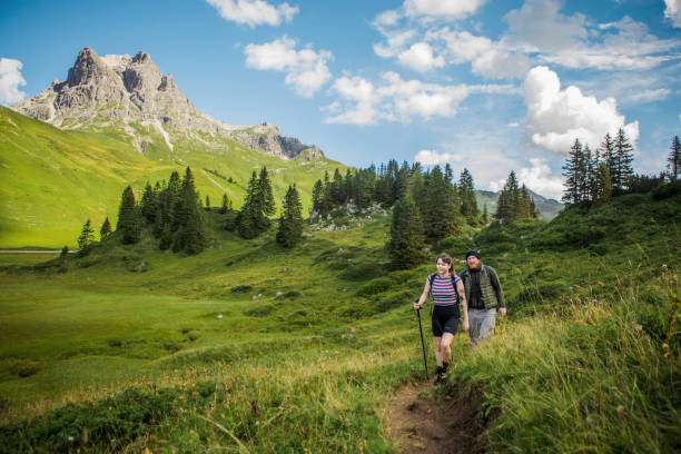 istock Two hikers in the alpine mountain countryside 1270269341
