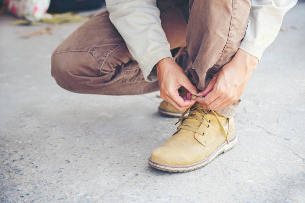 istock Man wear brown boots. Travel Concept. 1270270286