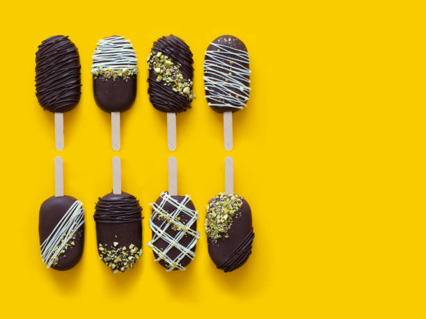 istock Vegan chocolate cake pops ice creams on the yellow background. 1270270317