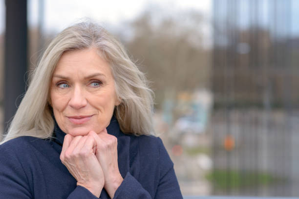 istock Attractive mature woman with a pleased smile 1270271421