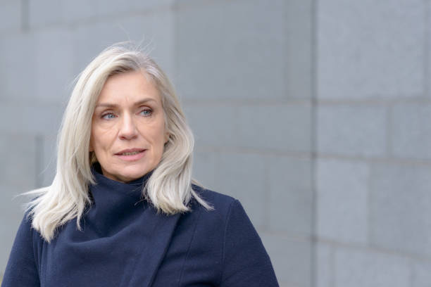 istock Thoughtful attractive blond woman looking aside 1270272044